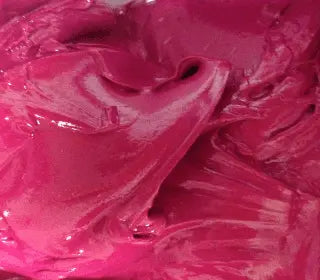 Vibrant cerise plastisol ink ideal for screen printing on various fabrics with a smooth application.